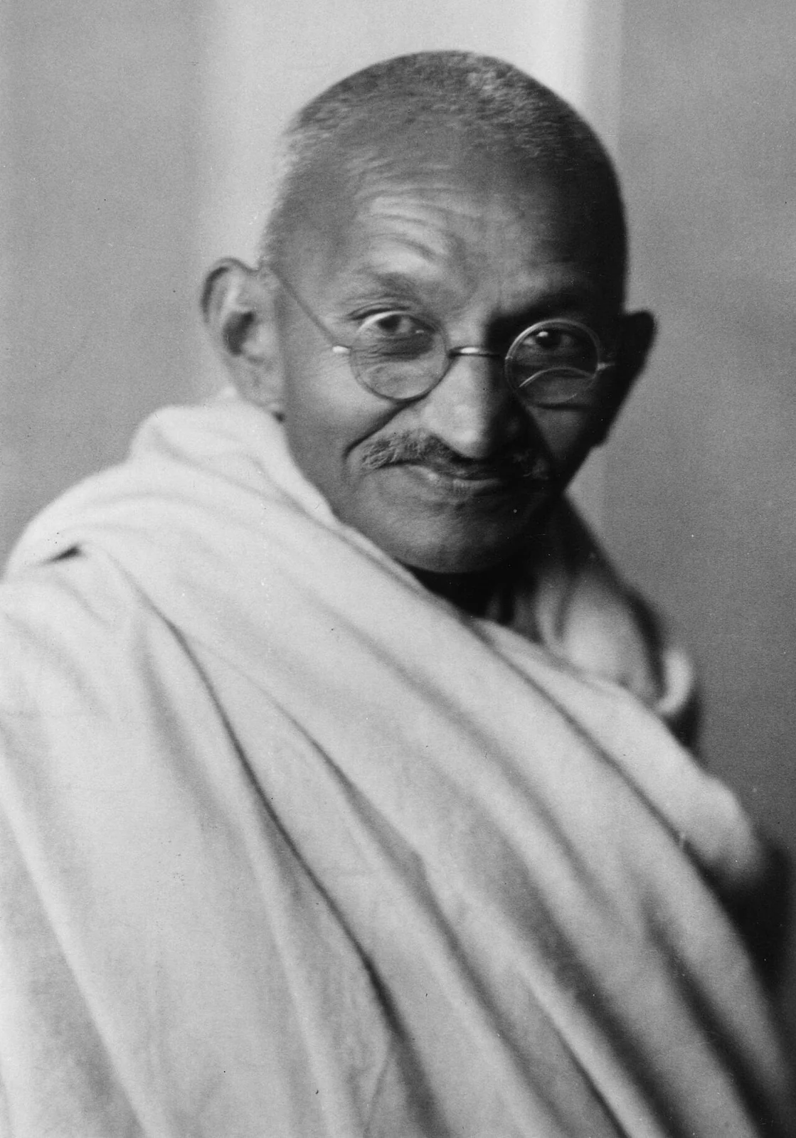 Mahatma Gandhi wearing glasses and a shawl