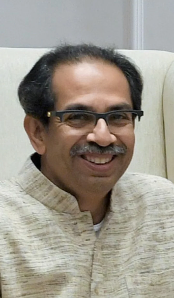 Uddhav Thackeray in spectacles and a light kurta, smiling