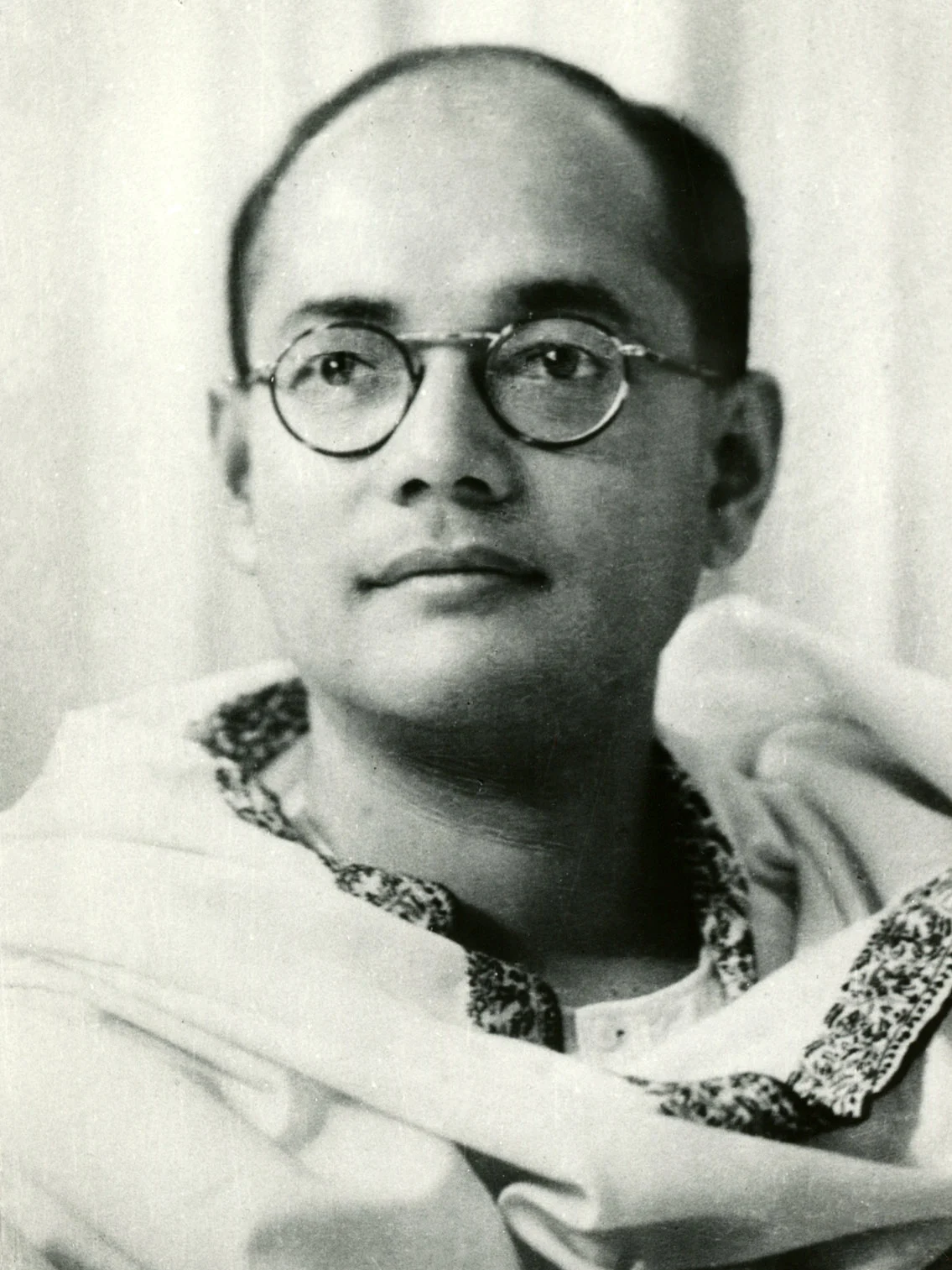 Subhas Chandra Bose in round glasses and a shawl